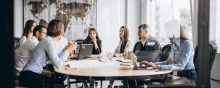 Group of people working out business plan in an office